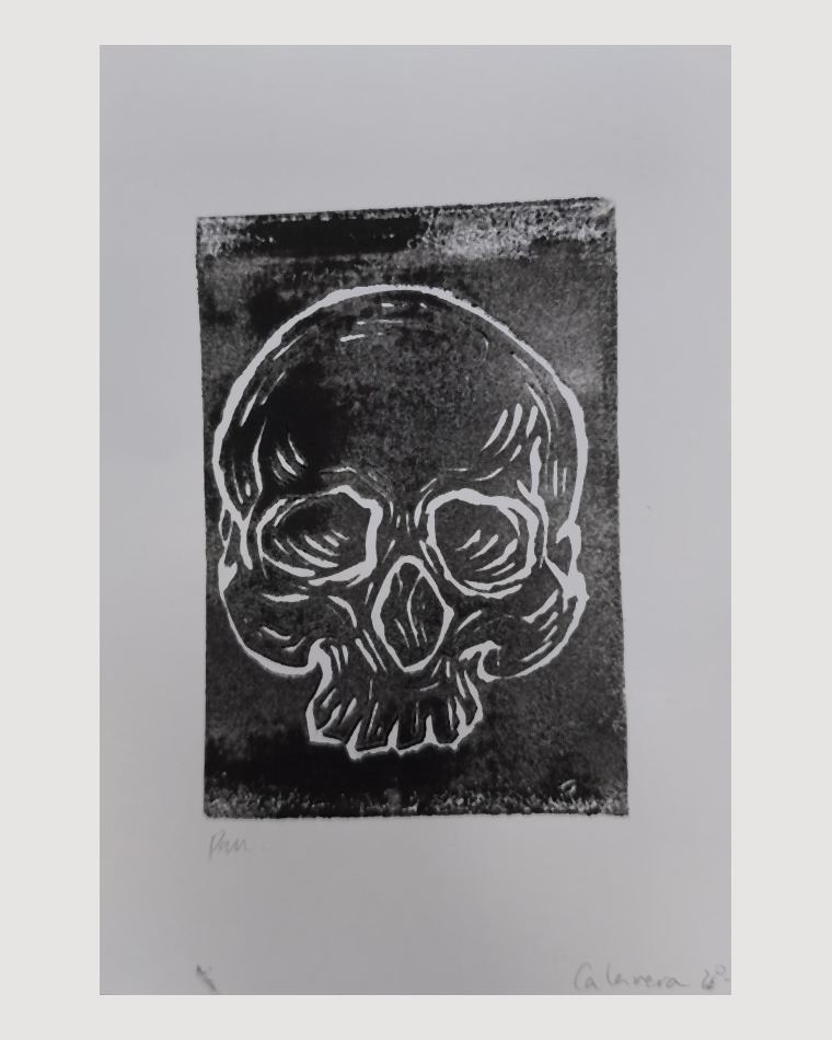 Linograbado original de una calavera, impreso a mano en tinta negra sobre papel